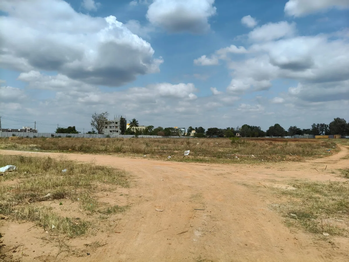 Garden Breeze internal access road, site progress August 2026 Prestige Garden Breeze site with internal access track, Sarjapur Road